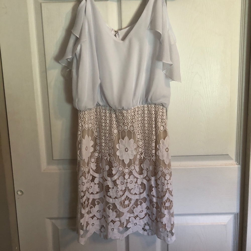 Off the shoulder white dress.